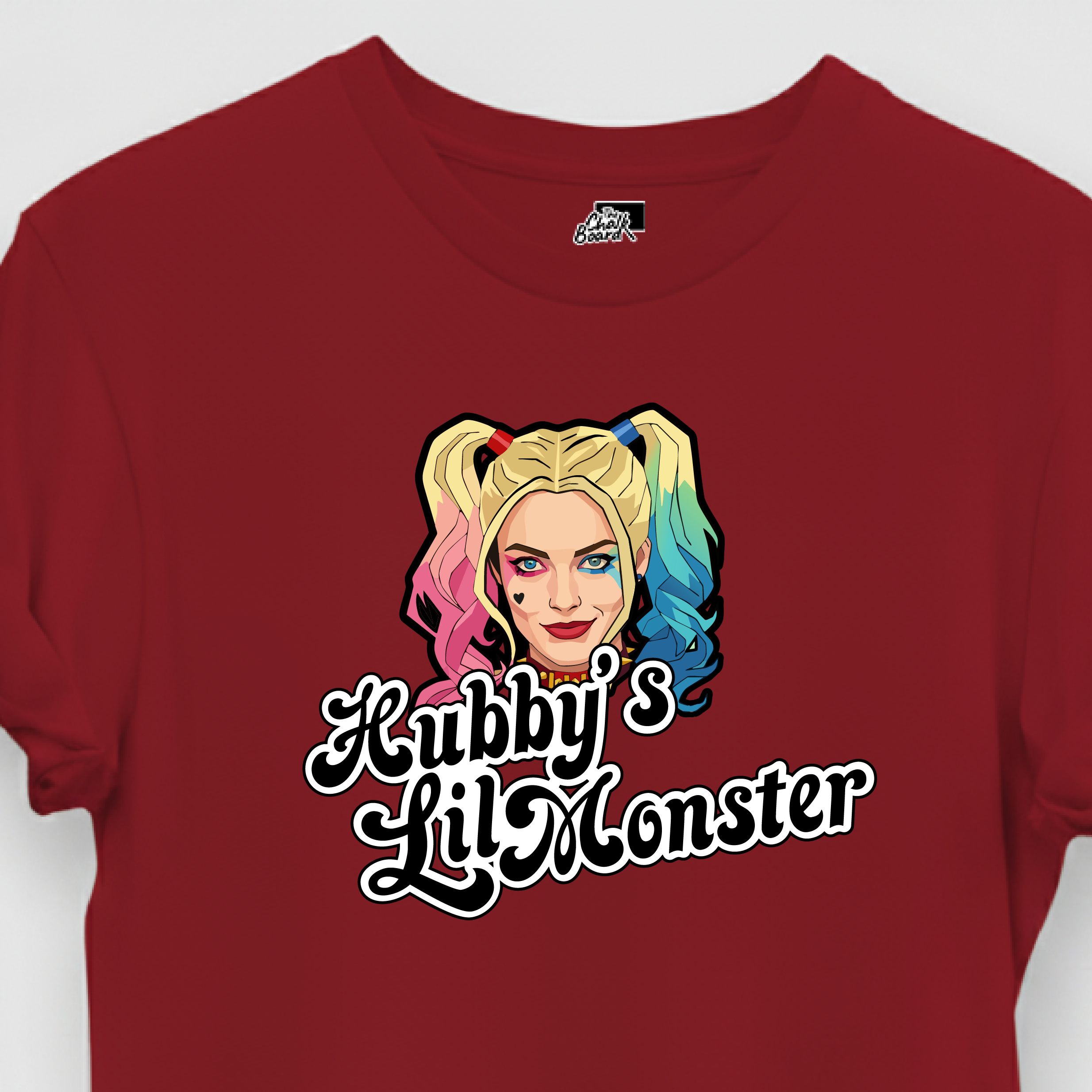 Red t-shirt with a graphic of a character with colorful hair and text on a white background